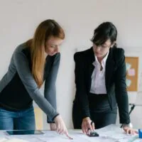 Two women are working on a project together.