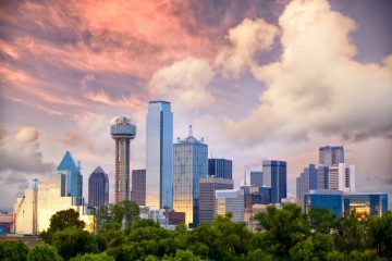 A view of the city skyline from across the street.