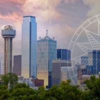 A picture of the dallas skyline with a ferris wheel in the background.