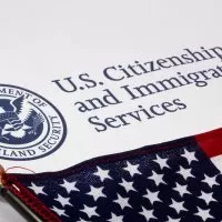 A close up of the u. S. Citizenship and immigration services logo
