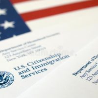 A close up of an american flag and some papers