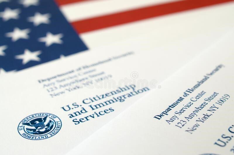 A close up of an american flag and some papers