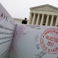 A person standing in front of the supreme court.