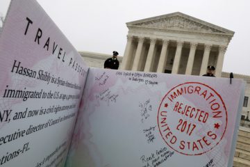 A person standing in front of the supreme court.