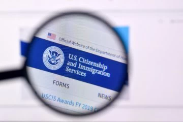 A close up of the uscis logo on a computer screen.