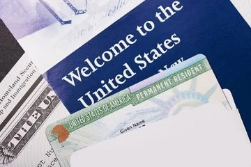 A close up of the welcome to the united states sign.