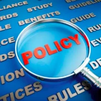 A magnifying glass over the word policy.