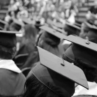 A group of graduates in caps and gowns.