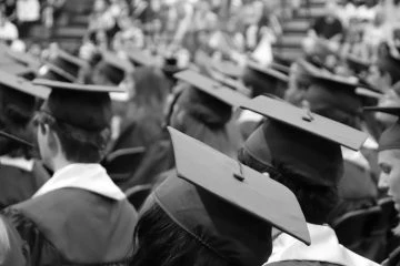A group of graduates in caps and gowns.