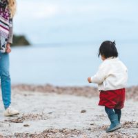 A woman and child on the beach